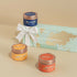 Three small candles with lids and a Diya Aroma gift box on a beige background